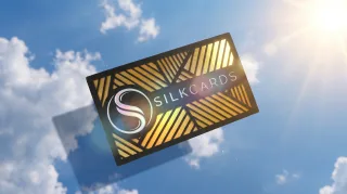Raised foil rising off the card with visible height and texture.
