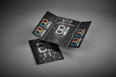 Tri-fold brochure with holographic foil, unfolded on a table