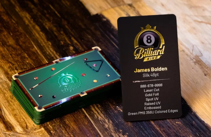 A black "8 Billiard King" Silk 48pt card with gold foil, Spot UV, raised UV, and embossed detail, next to its billiard-table gift-card sibling.