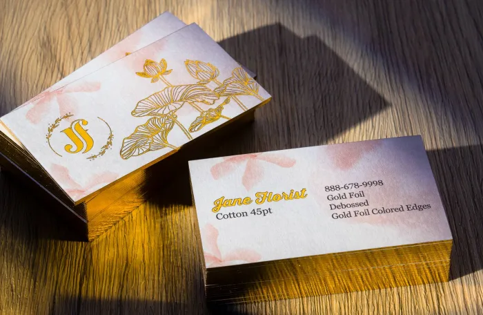 Cotton 45pt letterpress cards for Jane Florist with gold foil botanical artwork and gold foiled edges