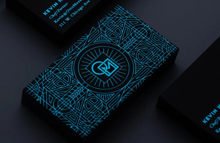 Black Onyx suede Otto Mezzo card with a cyan foil geometric pattern